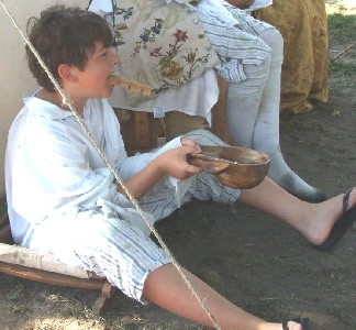 Josh sitting with his wooden bowl